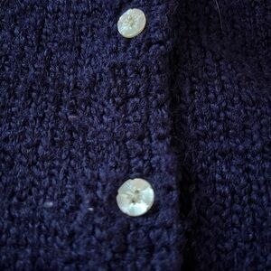 Navy blue, roughly a size medium cardigan